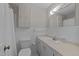 Bright bathroom with a tiled wall, updated vanity, and good storage at 6216 Lewisand Cir, Raleigh, NC 27615