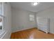 Open bedroom with light-colored walls and bright window at 6216 Lewisand Cir, Raleigh, NC 27615