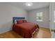 Bedroom with wood floor, natural light, and ample closet space at 6216 Lewisand Cir, Raleigh, NC 27615