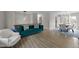 Spacious living room with hardwood floors adjacent to the dining room and kitchen is perfect for entertaining at 6216 Lewisand Cir, Raleigh, NC 27615