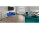 Bright living room with large window and hardwood floors provides a modern and inviting atmosphere at 6216 Lewisand Cir, Raleigh, NC 27615
