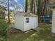 Backyard shed featuring a single window, double doors, and good storage at 6216 Lewisand Cir, Raleigh, NC 27615