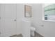 Clean half bathroom features white walls, modern fixtures, and a minimalist aesthetic for a fresh and inviting space at 63 Mable Court # 6, Lillington, NC 27546
