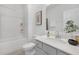 Well-lit bathroom with shower-tub combo, vanity with sink, and modern fixtures, offering a functional and stylish space at 63 Mable Court # 6, Lillington, NC 27546