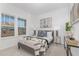 Bright bedroom boasts natural light, modern decor, and plush bedding, creating a peaceful and inviting atmosphere at 63 Mable Court # 6, Lillington, NC 27546