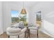 Inviting breakfast nook featuring a glass table, four chairs, and natural light at 63 Mable Court # 6, Lillington, NC 27546