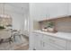 Bright dining area with modern white cabinets and a nearby dining table perfect for enjoying meals at 63 Mable Court # 6, Lillington, NC 27546