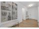 Inviting foyer with modern art, hardwood floors, a bench, and an open layout for a welcoming entrance at 63 Mable Court # 6, Lillington, NC 27546