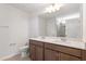 Bathroom featuring double sink vanity with ample counter space and a framed mirror at 65 Cordoba Dr, Franklinton, NC 27525