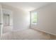Comfortable bedroom featuring plush carpeting, a nearby window, and lots of natural light at 65 Cordoba Dr, Franklinton, NC 27525