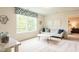Bright and airy bonus room featuring a comfortable sofa and large window views at 65 Cordoba Dr, Franklinton, NC 27525