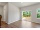Bright living room with sliding glass doors that open onto a deck, offering a view of lush greenery at 65 Cordoba Dr, Franklinton, NC 27525