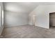 Spacious main bedroom with neutral carpeting, featuring a walk-in closet at 65 Cordoba Dr, Franklinton, NC 27525