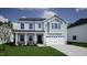 A modern two-story home with a two-car garage, stone accents, and pleasing curb appeal at 70 Cordoba Dr, Franklinton, NC 27525