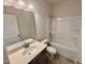 Well-lit bathroom featuring a vanity with a sink and a shower-tub combo at 76 Commons Cir, Clayton, NC 27520