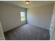 Clean bedroom with plush carpeting, a neutral color scheme, and natural light at 76 Commons Cir, Clayton, NC 27520
