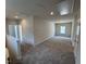 Spacious bonus room with neutral walls and plush carpeting, offering versatility and comfort at 76 Commons Cir, Clayton, NC 27520