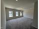 Bonus room with plush carpeting and natural light at 76 Commons Cir, Clayton, NC 27520