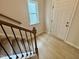 Tiled entryway and staircase with a window at 76 Commons Cir, Clayton, NC 27520