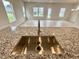 Close-up of a kitchen sink and granite countertop at 76 Commons Cir, Clayton, NC 27520
