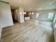 Open-concept living room featuring hardwood floors, recessed lighting, and a view into the kitchen at 76 Commons Cir, Clayton, NC 27520