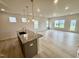 Bright, open-concept kitchen and living area with modern finishes at 76 Commons Cir, Clayton, NC 27520
