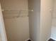 Uncluttered walk-in closet providing ample storage space at 76 Commons Cir, Clayton, NC 27520
