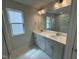Bathroom features dual sink vanity, large mirror, and plenty of counter space at 765 Portland Rose Dr, Knightdale, NC 27545