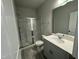 Bathroom featuring a glass-enclosed shower, modern vanity, and stylish flooring at 765 Portland Rose Dr, Knightdale, NC 27545