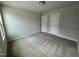 This bedroom features neutral carpet and paint and two closets for storage space at 765 Portland Rose Dr, Knightdale, NC 27545
