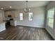 Bright dining area with hardwood floors connecting the kitchen, bathed in natural light at 765 Portland Rose Dr, Knightdale, NC 27545