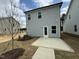 Back exterior of home with cement patio and grass yard at 765 Portland Rose Dr, Knightdale, NC 27545