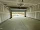 View of a single car garage with an opened door and light colored walls at 765 Portland Rose Dr, Knightdale, NC 27545