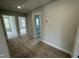 Hallway with multiple entrances to rooms and carpeted floors at 765 Portland Rose Dr, Knightdale, NC 27545