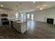 Spacious living room seamlessly integrates with the kitchen, featuring stainless steel appliances at 765 Portland Rose Dr, Knightdale, NC 27545