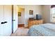 Cozy bedroom with a bed, dresser, and TV, offering a comfortable and private retreat at 79 Hillgrove Dr, Willow Springs, NC 27592