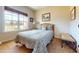 Inviting bedroom with a comfortable bed, large window, and tranquil decor for a relaxing atmosphere at 79 Hillgrove Dr, Willow Springs, NC 27592