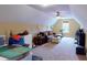 Cozy bonus room featuring plush carpeting, a comfortable sofa, and a ceiling fan for added comfort at 79 Hillgrove Dr, Willow Springs, NC 27592