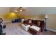Bonus room with sloped ceilings, plush seating, and cozy atmosphere at 79 Hillgrove Dr, Willow Springs, NC 27592