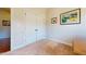 Neutral-toned room with a double door closet and base molding at 79 Hillgrove Dr, Willow Springs, NC 27592