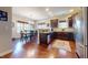 Open kitchen and dining area with stainless steel appliances and wood floors at 79 Hillgrove Dr, Willow Springs, NC 27592