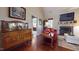 Cozy living room with hardwood floors, fireplace and comfortable red seating area at 79 Hillgrove Dr, Willow Springs, NC 27592