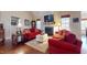 Bright living room featuring a fireplace, hardwood floors, and comfortable seating at 79 Hillgrove Dr, Willow Springs, NC 27592