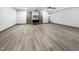Spacious basement with wood floors, neutral walls, and modern lighting at 8125 Park Side Dr, Raleigh, NC 27612