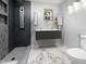 Modern bathroom with floating vanity, double sinks, and a sleek shower with rainfall showerhead at 8125 Park Side Dr, Raleigh, NC 27612