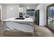 Modern kitchen with stainless appliances and a large waterfall island at 8125 Park Side Dr, Raleigh, NC 27612