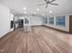 Open concept living room and kitchen with light floors and neutral colors at 8125 Park Side Dr, Raleigh, NC 27612