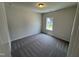 Bedroom featuring plush carpeting and a window offering views of the outdoors at 84 Commons Cir, Clayton, NC 27520
