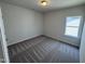 Bedroom with plush patterned carpeting and a window for natural light at 84 Commons Cir, Clayton, NC 27520