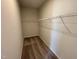 Walk-in closet with neutral paint and wire shelving for storage at 84 Commons Cir, Clayton, NC 27520